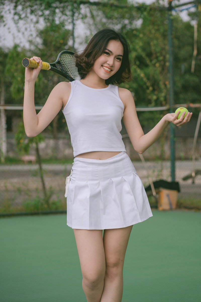 Tennis player holding a racket; illustrative stock photograph